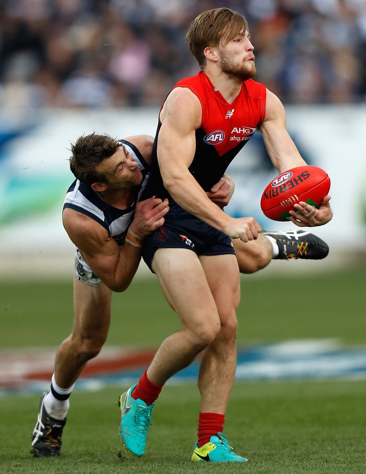 AFL 2016 Rd 23 - Geelong v Melbourne GEELONG, AUSTRALIA - AUGUST 27: Jack Viney of the Demons is tackled by Corey Enright of the Cats during the 2016 AFL Round 23 match between the Geelong Cats and the Melbourne Demons at Simonds Stadium on August 27, 2016 in Geelong, Australia. (Photo by Michael Willson/AFL Media)